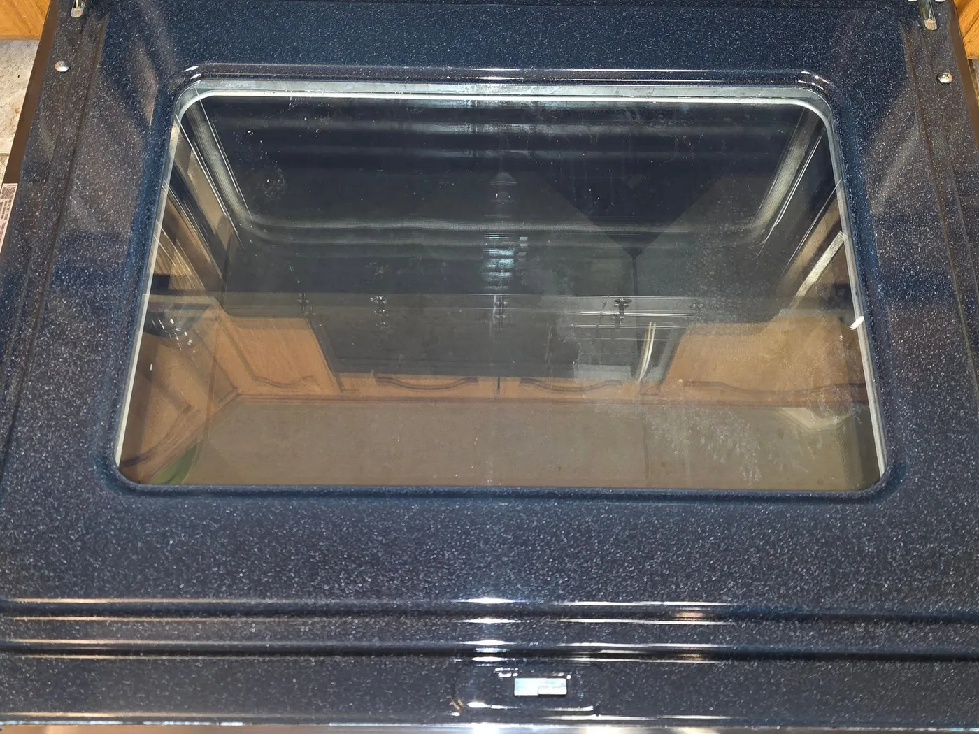 The same oven gleaming after a PureMind deep clean